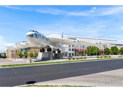 a living room with lots of furniture and a clock