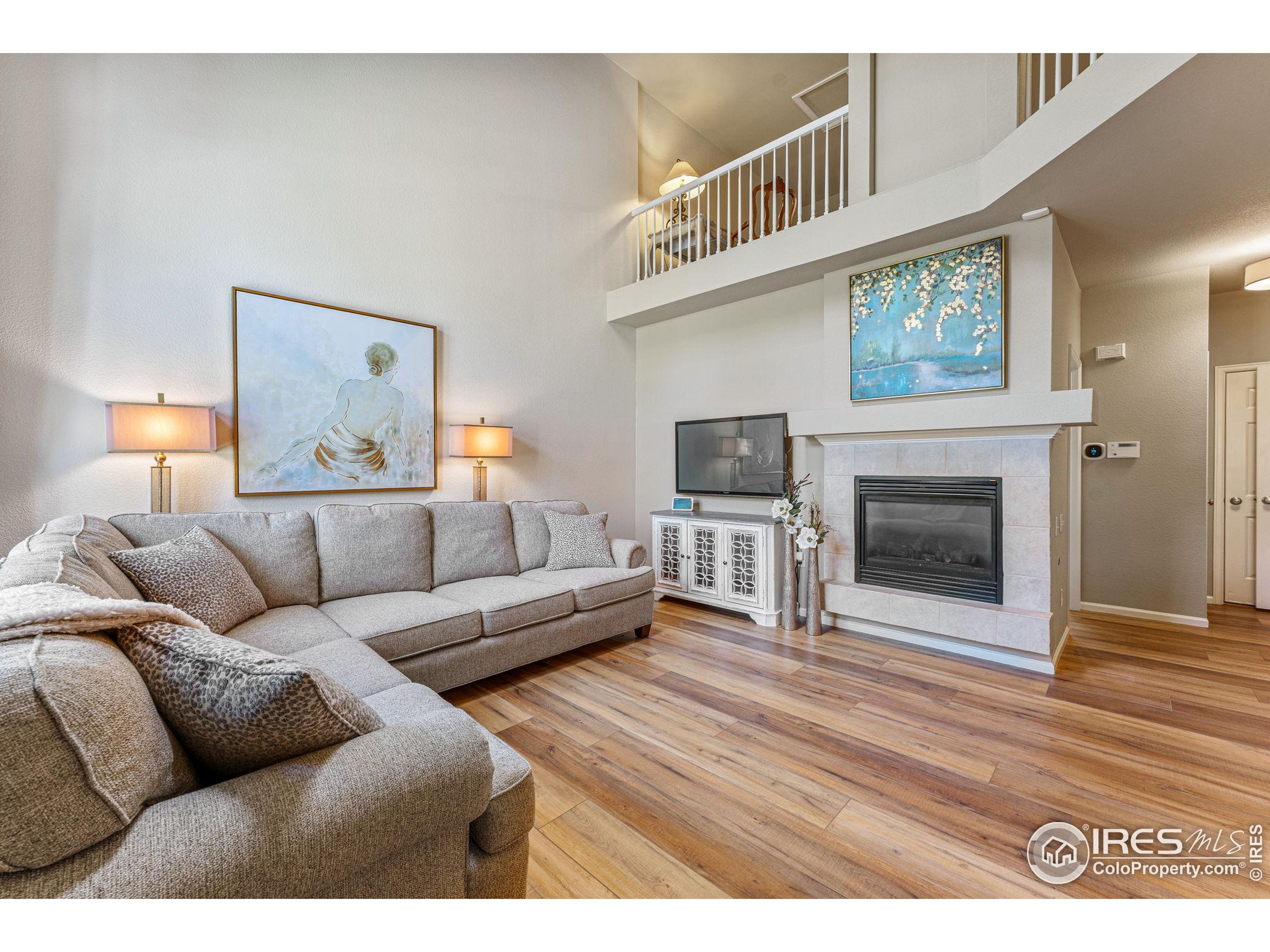 41 Quince Street Denver, CO 80230 - Photo 5 of 48 a living room with furniture and a fireplace