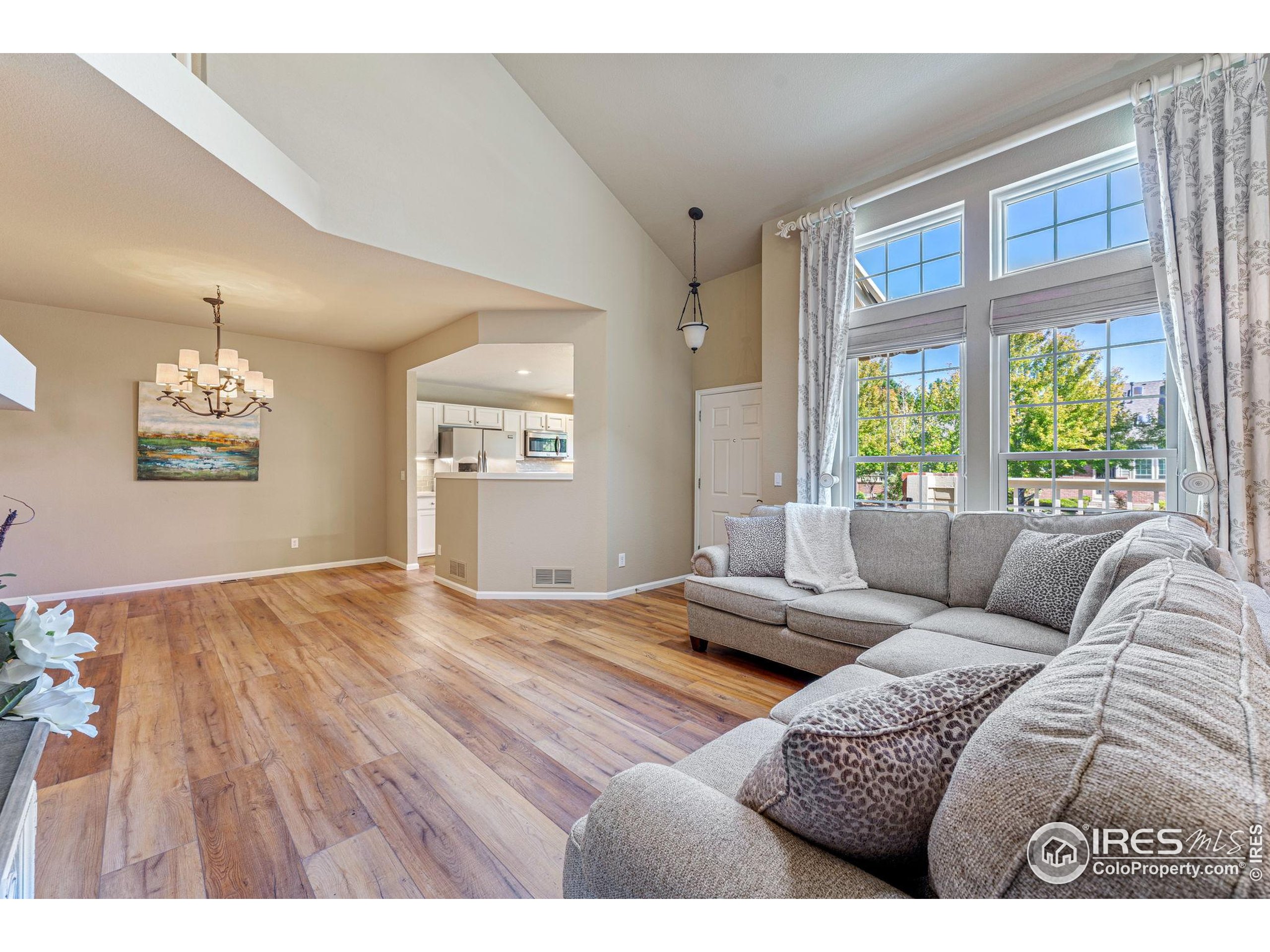 41 Quince Street Denver, CO 80230 - Photo 7 of 48 a living room with furniture and a large window