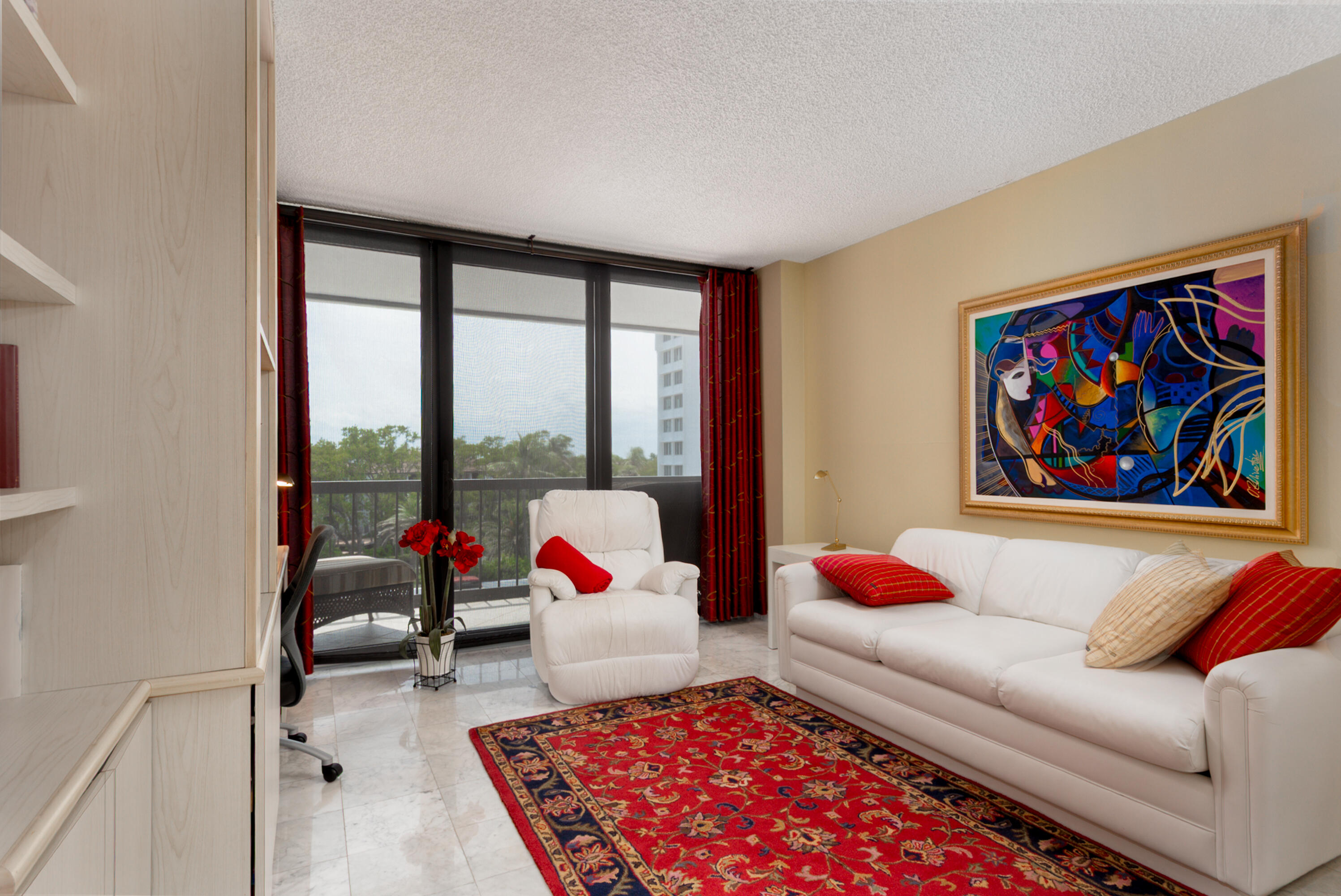 4748 South Ocean Boulevard, Unit 4B Highland Beach, FL 33487 - Photo 11 of 56 a living room with furniture or couch and a floor to ceiling window