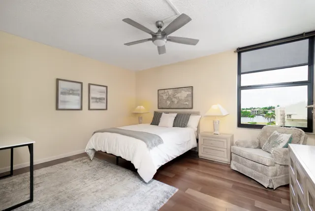 a balcony with table and chairs