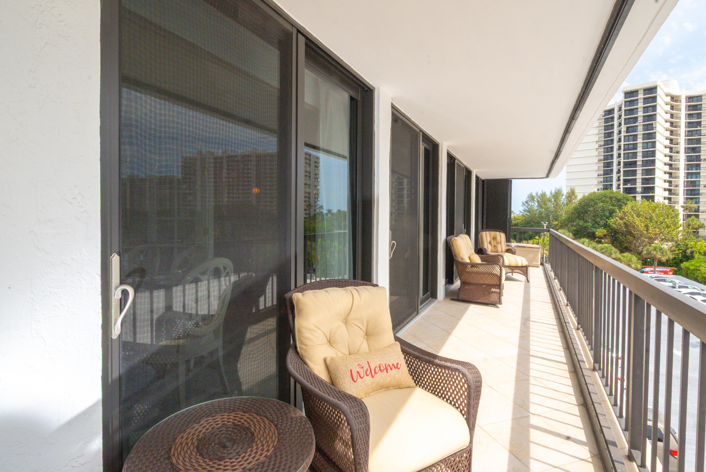 4748 South Ocean Boulevard, Unit 4B Highland Beach, FL 33487 - Photo 15 of 56 a balcony with table and chairs