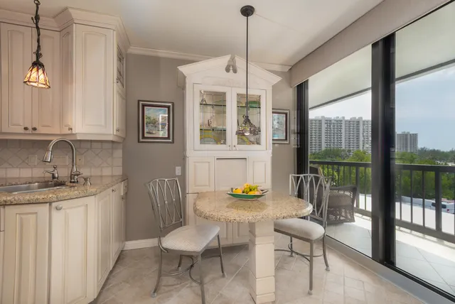 a view of a dining room with furniture window and outside view