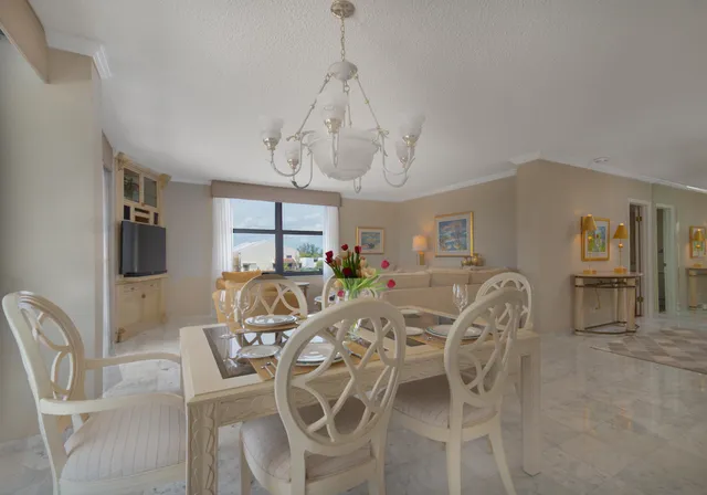 a living room with furniture and a workspace