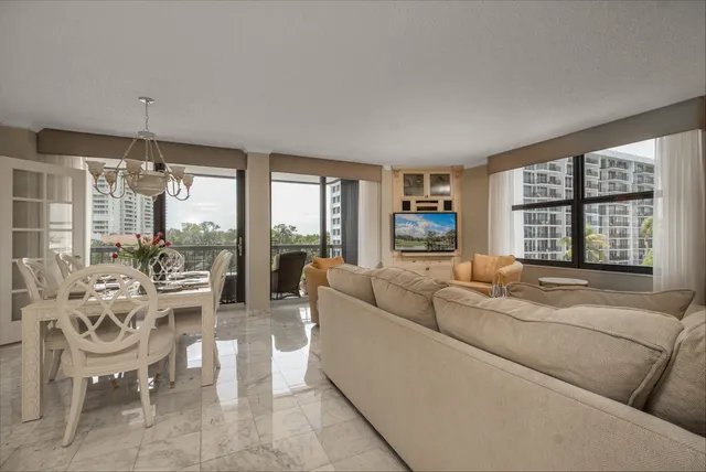 a bathroom with a granite countertop tub sink and mirror