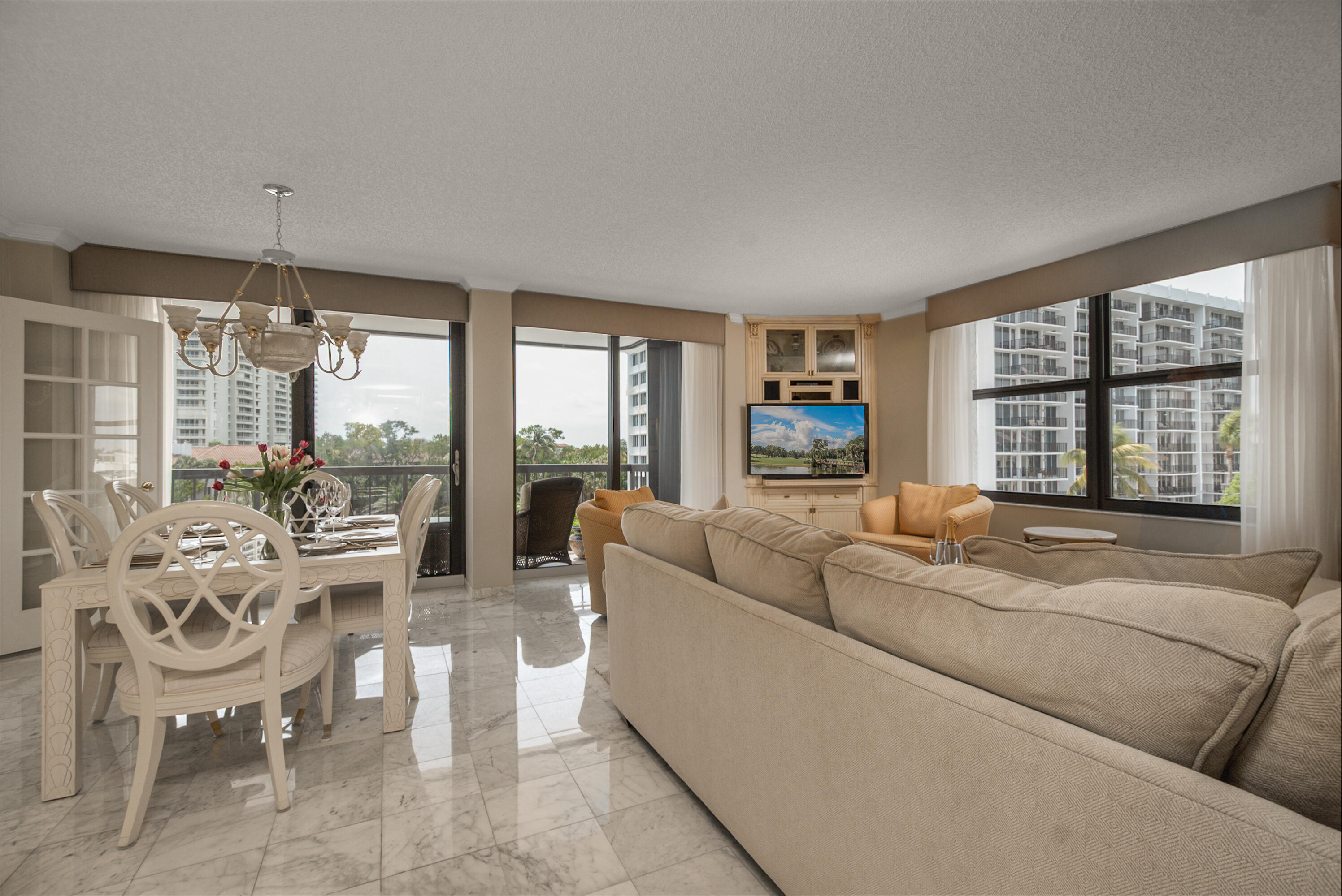 4748 South Ocean Boulevard, Unit 4B Highland Beach, FL 33487 - Photo 23 of 56 a living room with furniture and a large window