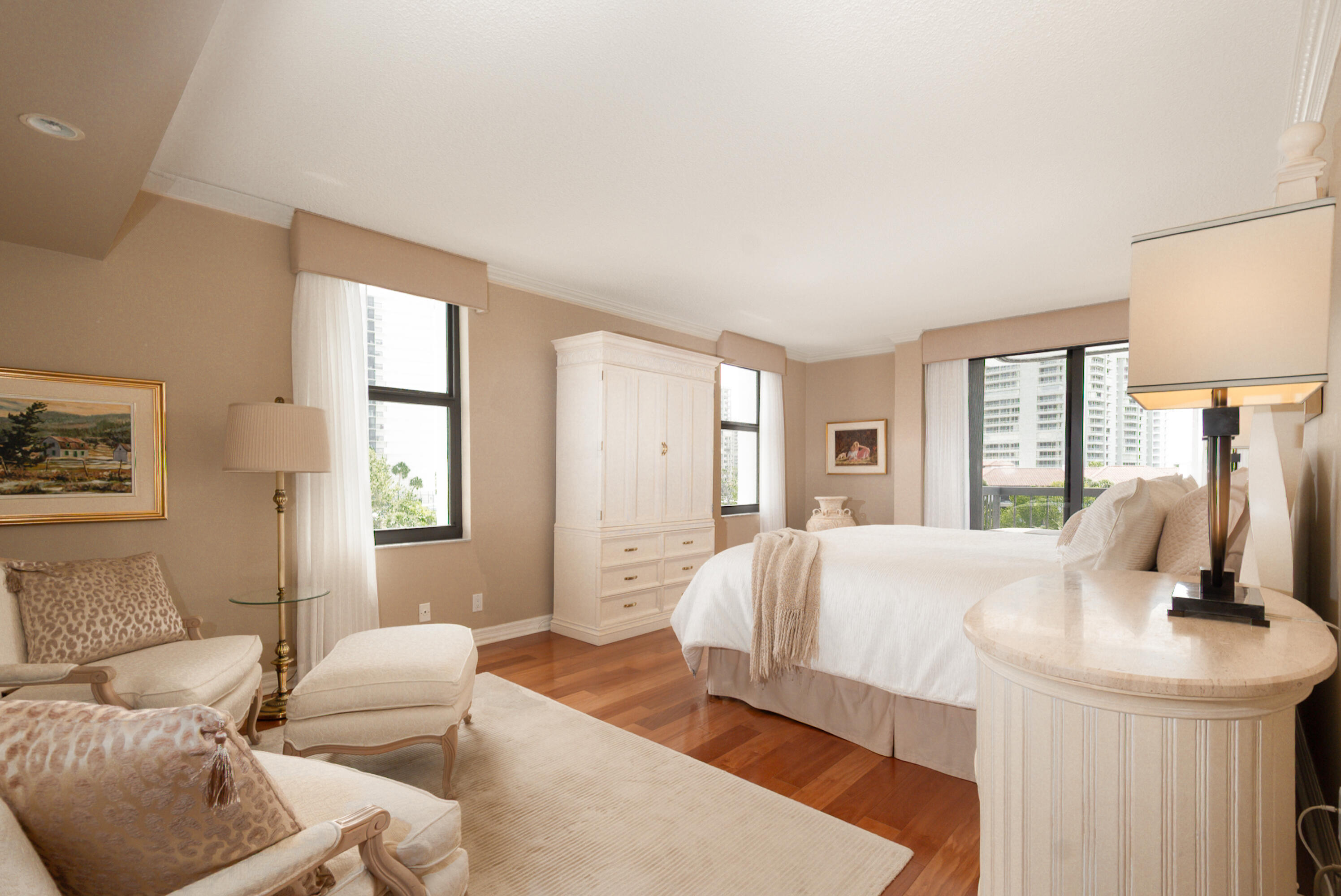 4748 South Ocean Boulevard, Unit 4B Highland Beach, FL 33487 - Photo 24 of 56 a bedroom with a bed and large windows