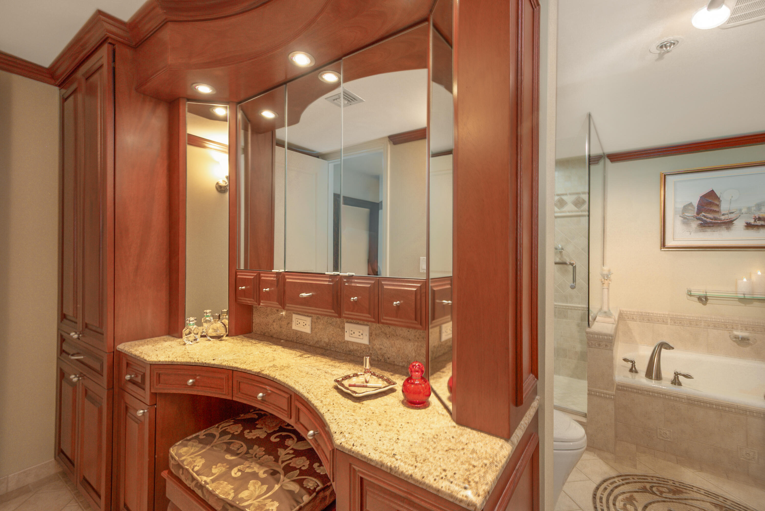 4748 South Ocean Boulevard, Unit 4B Highland Beach, FL 33487 - Photo 26 of 56 a bathroom with a granite countertop tub sink and mirror