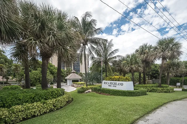 a view of a hallway with wooden floor and door