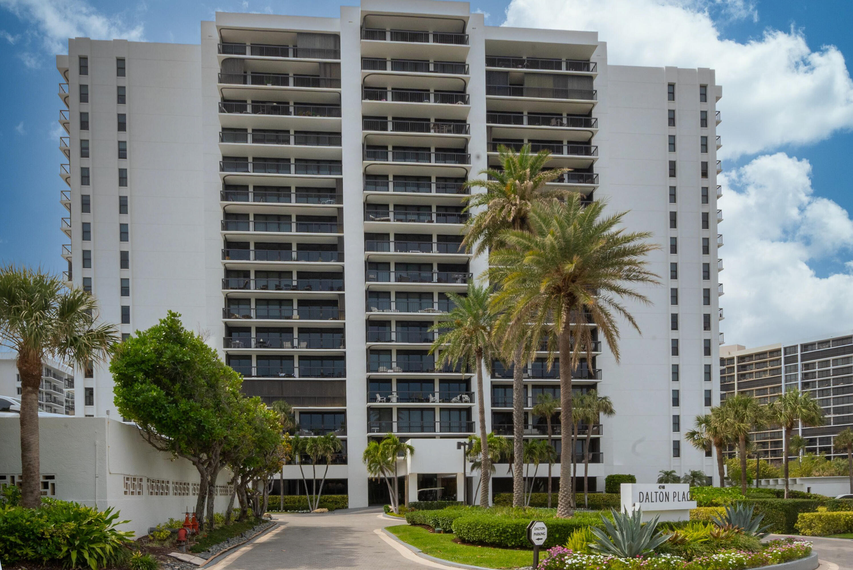 4748 South Ocean Boulevard, Unit 4B Highland Beach, FL 33487 - Photo 30 of 56 a front view of a building with a garden