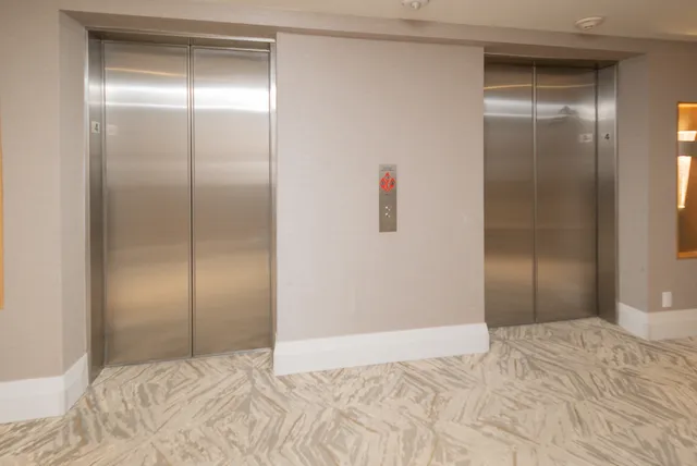 a living room with furniture dining table and a large window