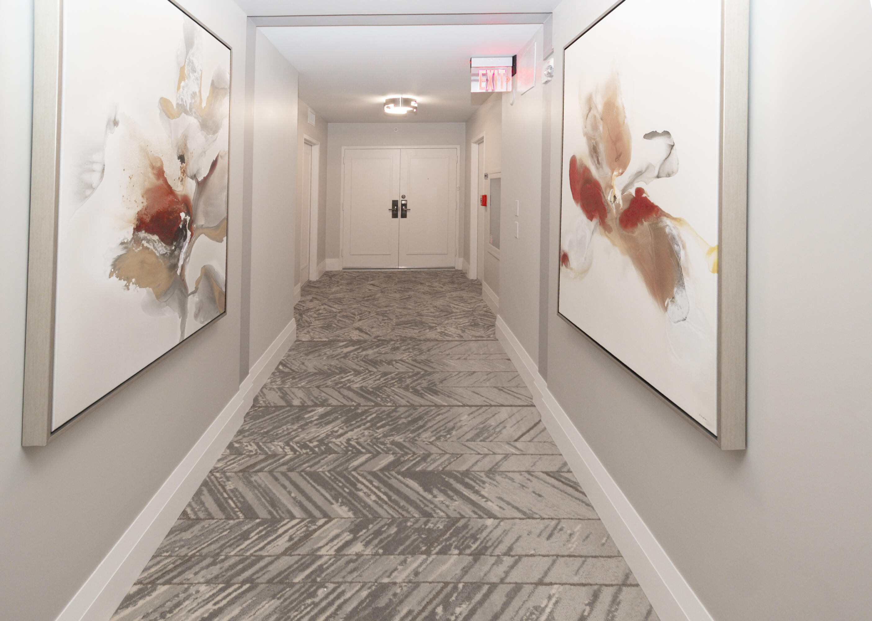 4748 South Ocean Boulevard, Unit 4B Highland Beach, FL 33487 - Photo 32 of 56 a view of a hallway with wooden floor and door
