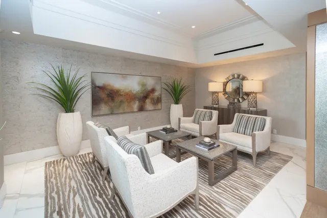 a kitchen with kitchen island a counter top space cabinets and stainless steel appliances