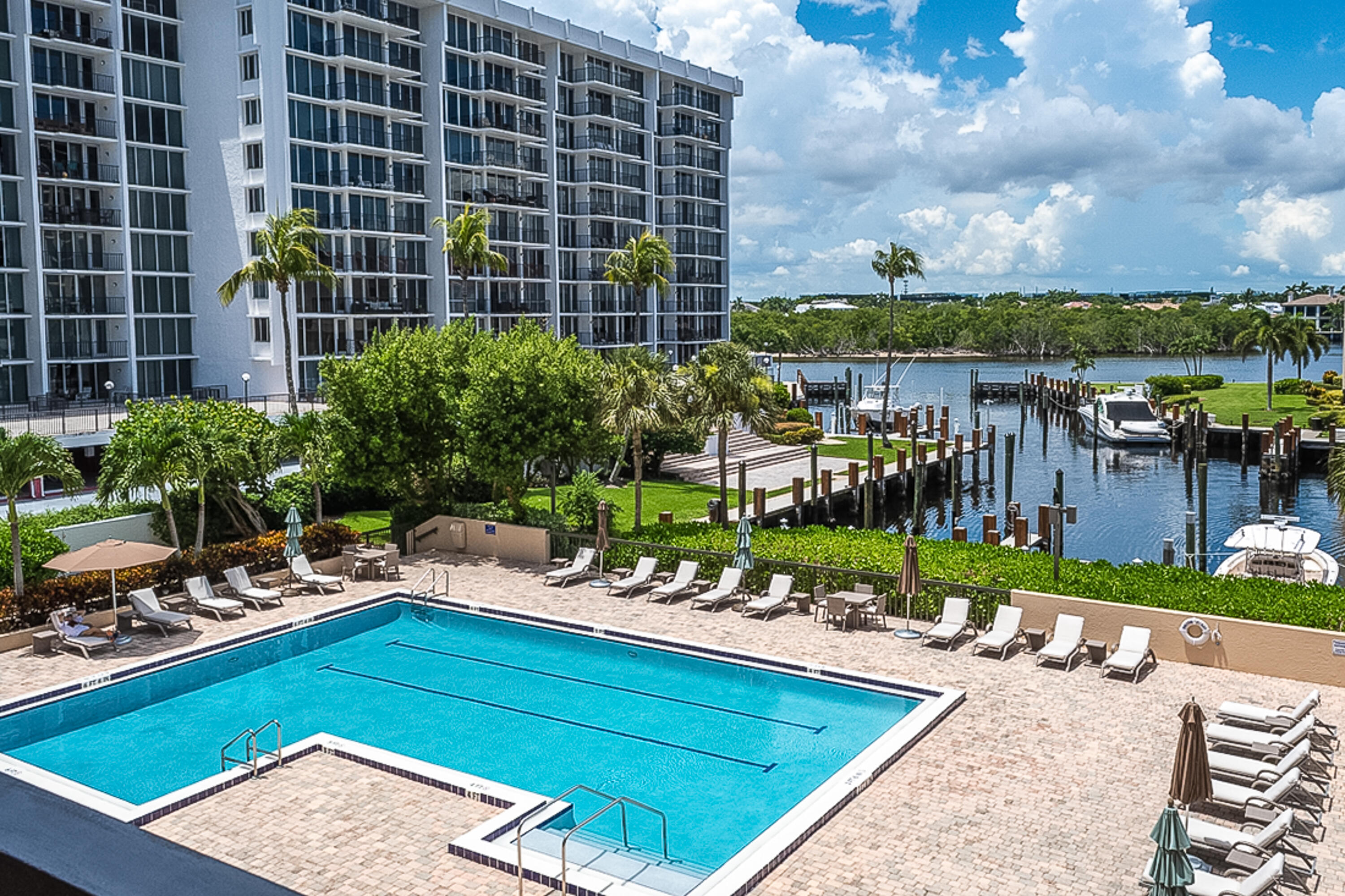 4748 South Ocean Boulevard, Unit 4B Highland Beach, FL 33487 - Photo 40 of 56 a view of a swimming pool with a patio