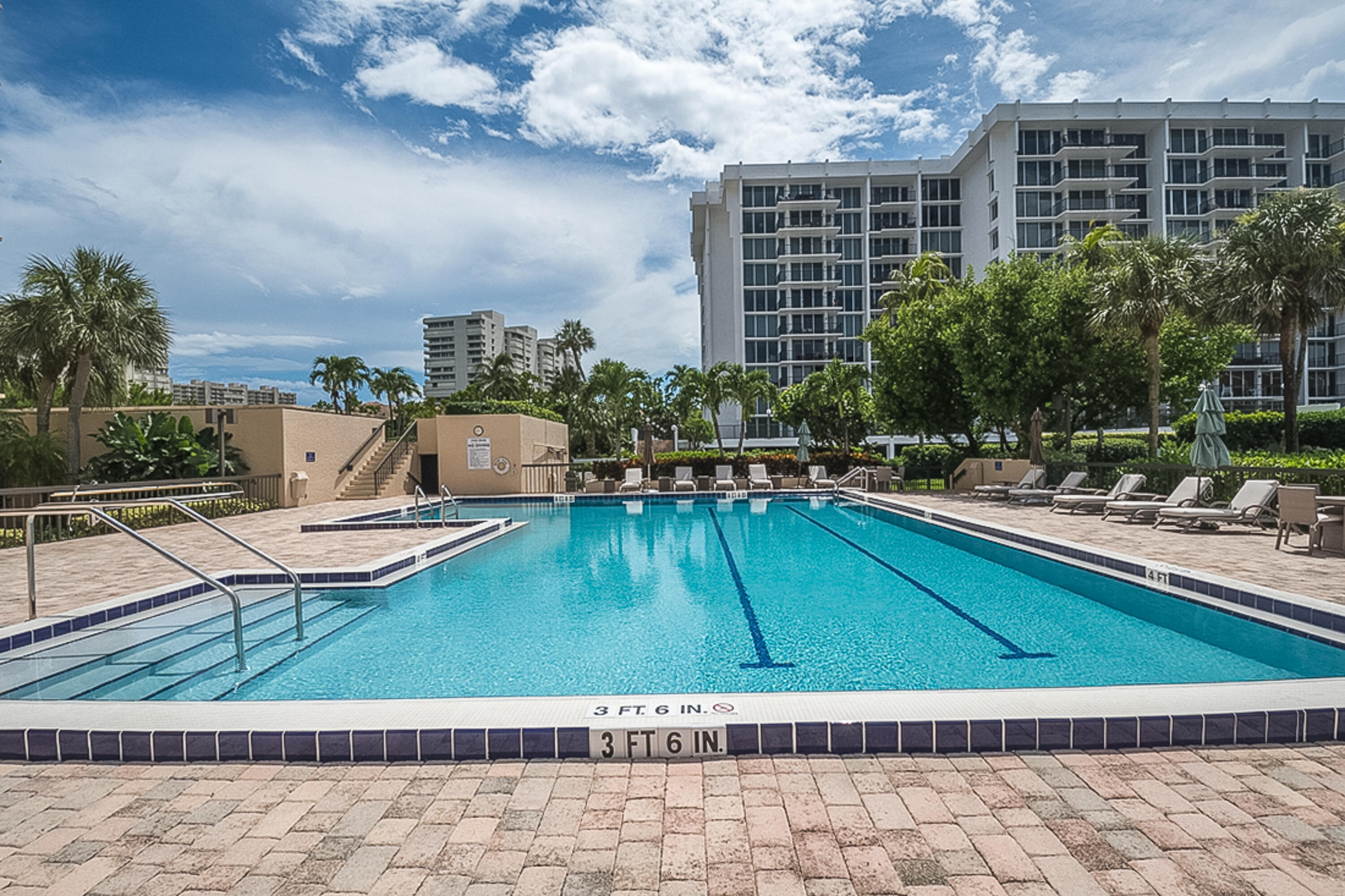 4748 South Ocean Boulevard, Unit 4B Highland Beach, FL 33487 - Photo 41 of 56 a swimming pool with outdoor seating and yard