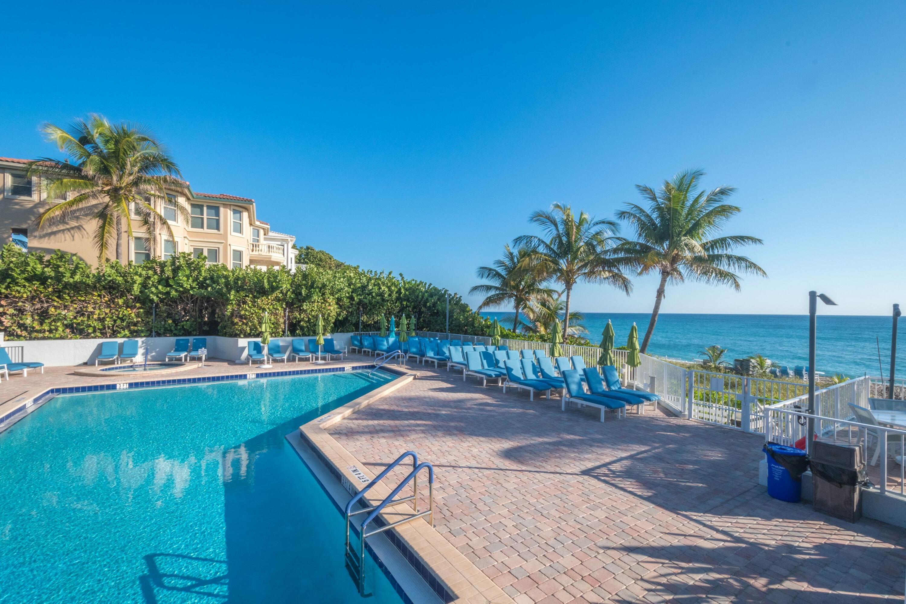 4748 South Ocean Boulevard, Unit 4B Highland Beach, FL 33487 - Photo 48 of 56 a view of a house with backyard and sitting area