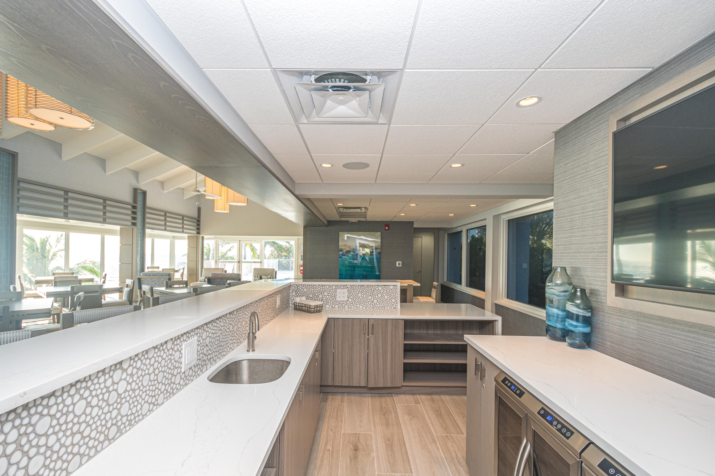 4748 South Ocean Boulevard, Unit 4B Highland Beach, FL 33487 - Photo 51 of 56 a large kitchen with kitchen island a large window a sink and stainless steel appliances