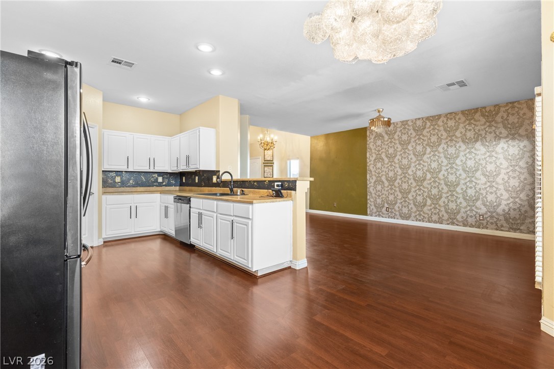 8934 Deep Ridge Court Las Vegas, NV 89178 - Photo 47 of 47 An open concept floorplan features a well-appointed kitchen flowing into a spacious living area.