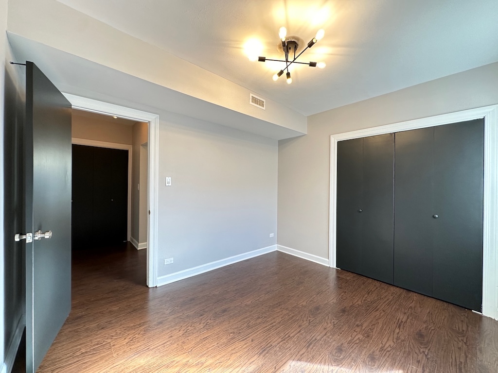 2617 West Rascher Avenue, Unit 2 Chicago, IL 60625 - Photo 15 of 20 a view of an empty room with closet and a bathroom