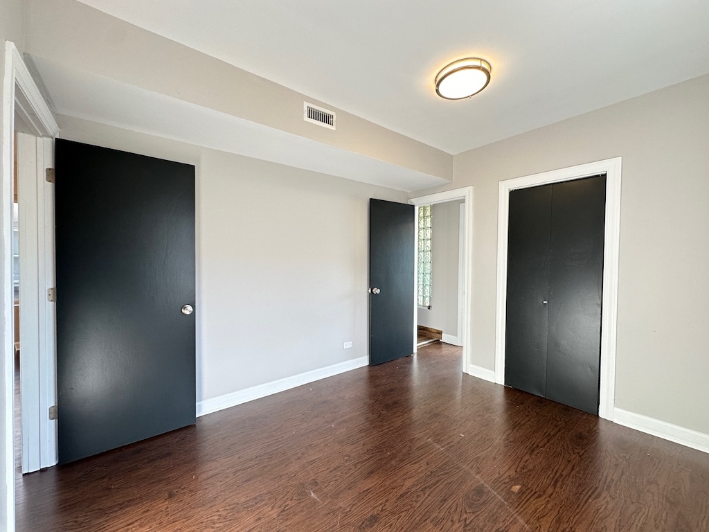 2617 West Rascher Avenue, Unit 2 Chicago, IL 60625 - Photo 2 of 20 a view of an empty room with wooden floor