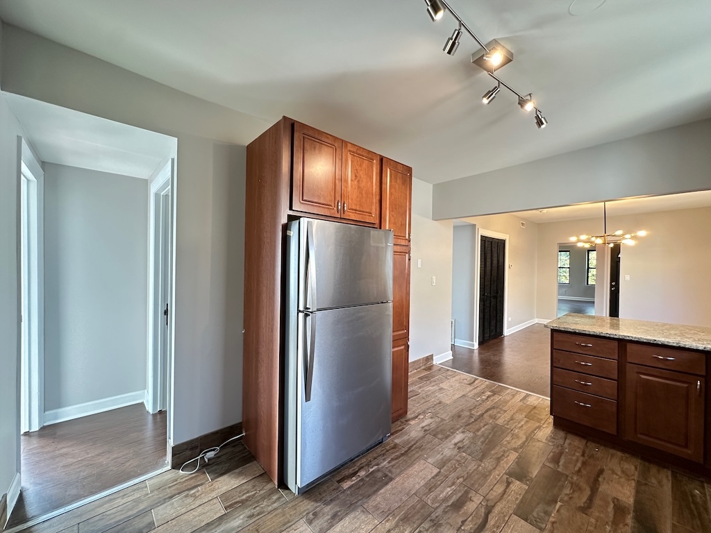 2617 West Rascher Avenue, Unit 2 Chicago, IL 60625 - Photo 6 of 20 a kitchen with a refrigerator and a sink