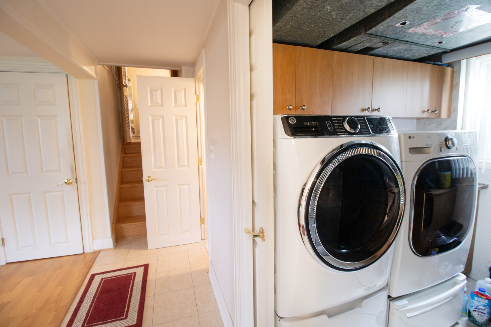 8662 North Merrill Street Niles, IL 60714 - Photo 22 of 27 a view of a hallway with washer and dryer