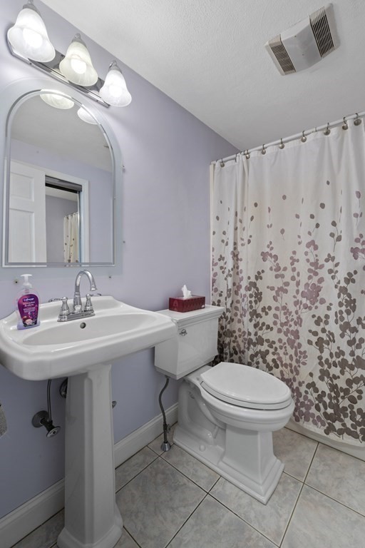 12 Sylvia Road Peabody, MA 01960 - Photo 17 of 42 a bathroom with a sink toilet and a mirror