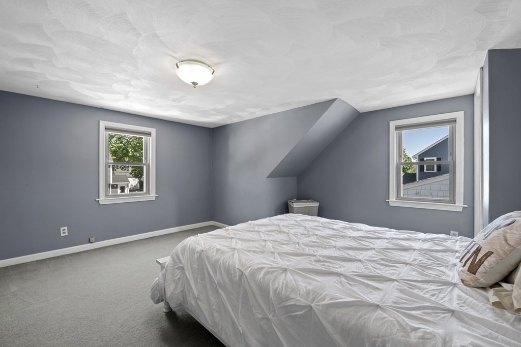 12 Sylvia Road Peabody, MA 01960 - Photo 28 of 42 a bedroom with a bed and a window