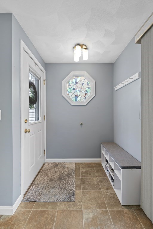 12 Sylvia Road Peabody, MA 01960 - Photo 4 of 42 a view of room with hallway and staircase