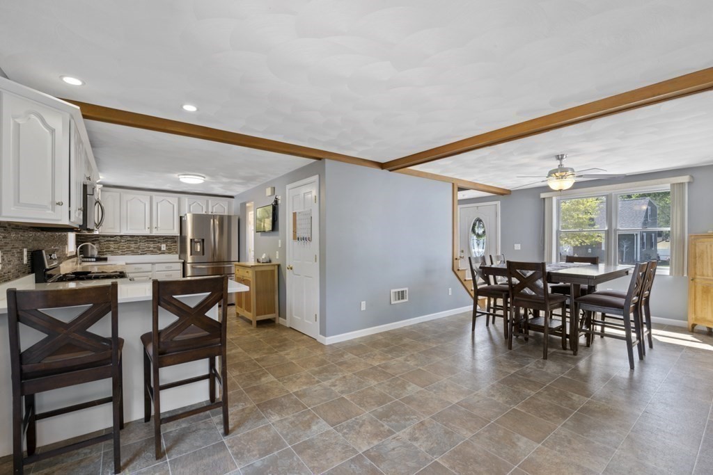 12 Sylvia Road Peabody, MA 01960 - Photo 8 of 42 a view of a dining room with furniture