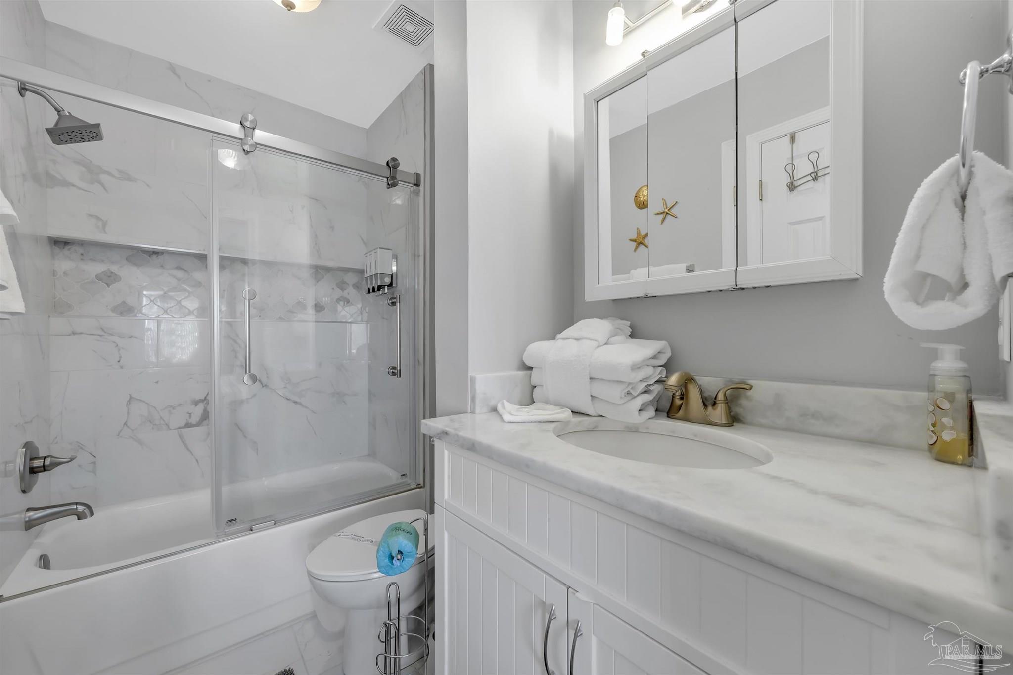 16310 Perdido Key Drive, Unit 9A Perdido Key, FL 32507 - Photo 13 of 26 a bathroom with a sink a toilet and shower