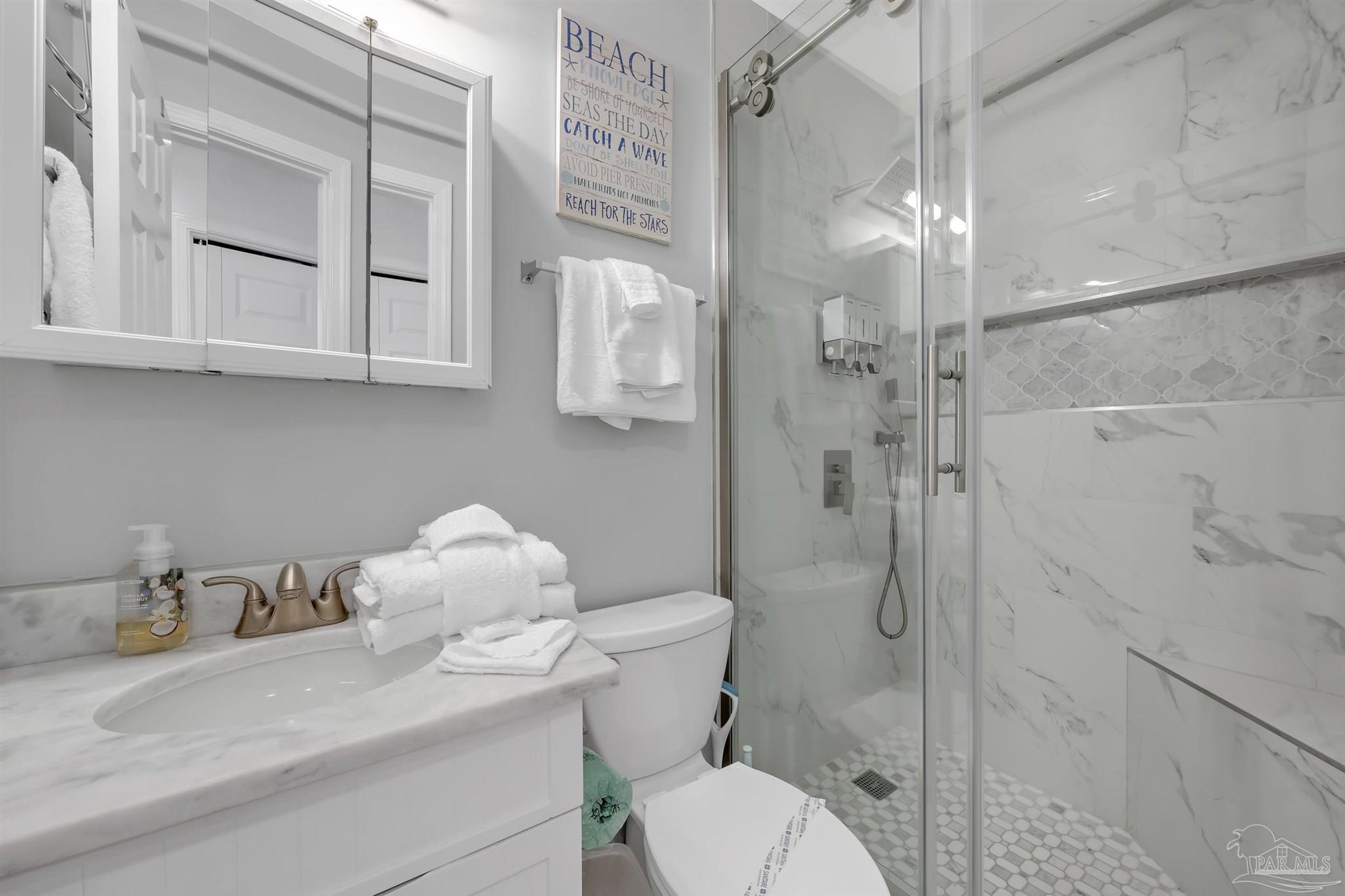 16310 Perdido Key Drive, Unit 9A Perdido Key, FL 32507 - Photo 15 of 26 a bathroom with a sink toilet and shower