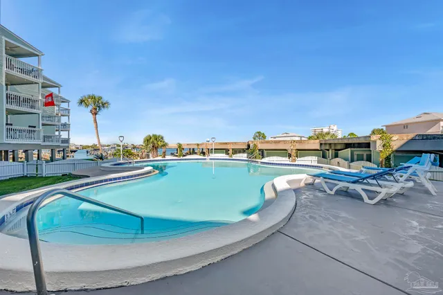 a view of a swimming pool with a lounge chairs