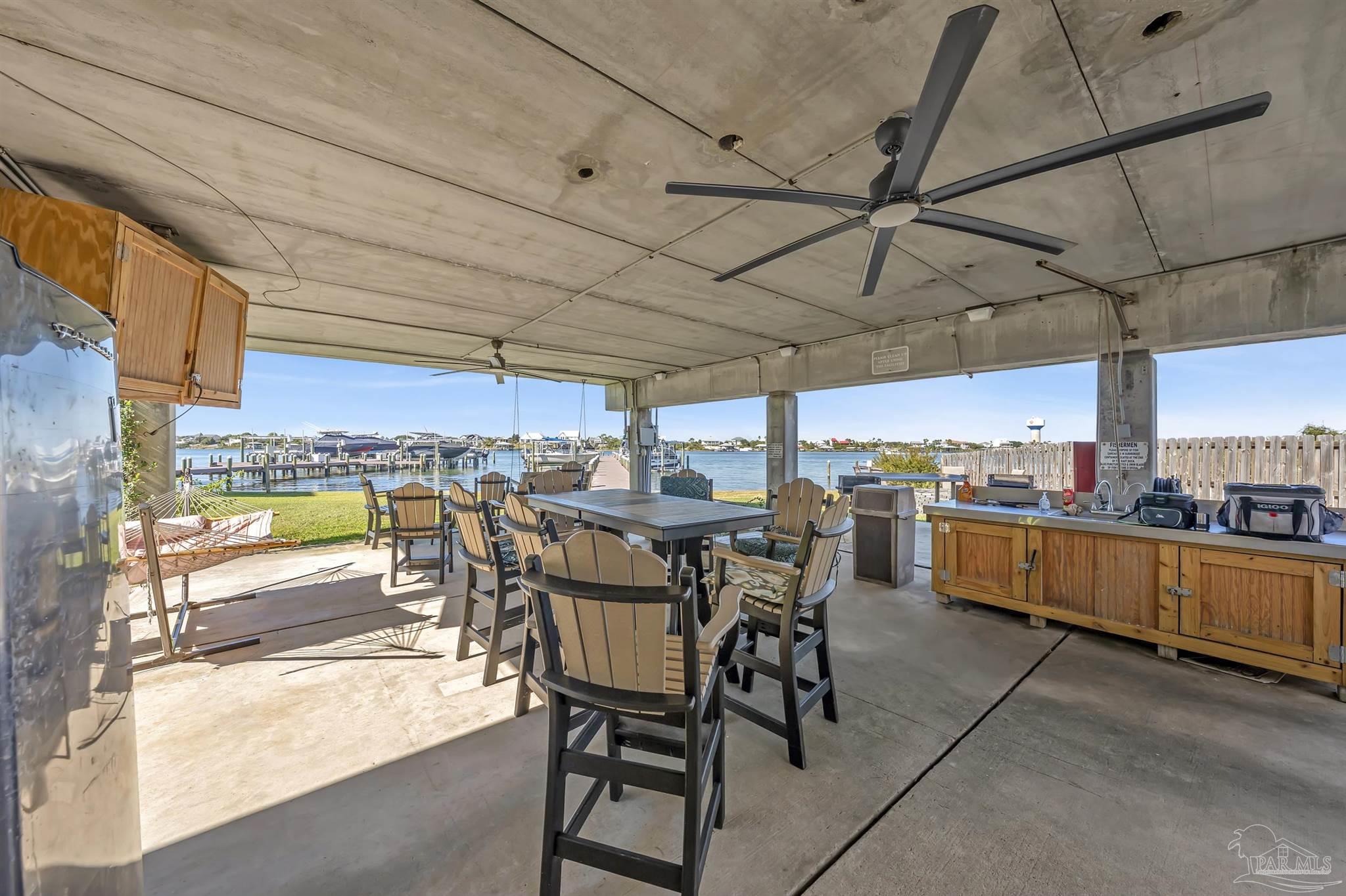 16310 Perdido Key Drive, Unit 9A Perdido Key, FL 32507 - Photo 21 of 26 a view of a patio with dining table and chairs