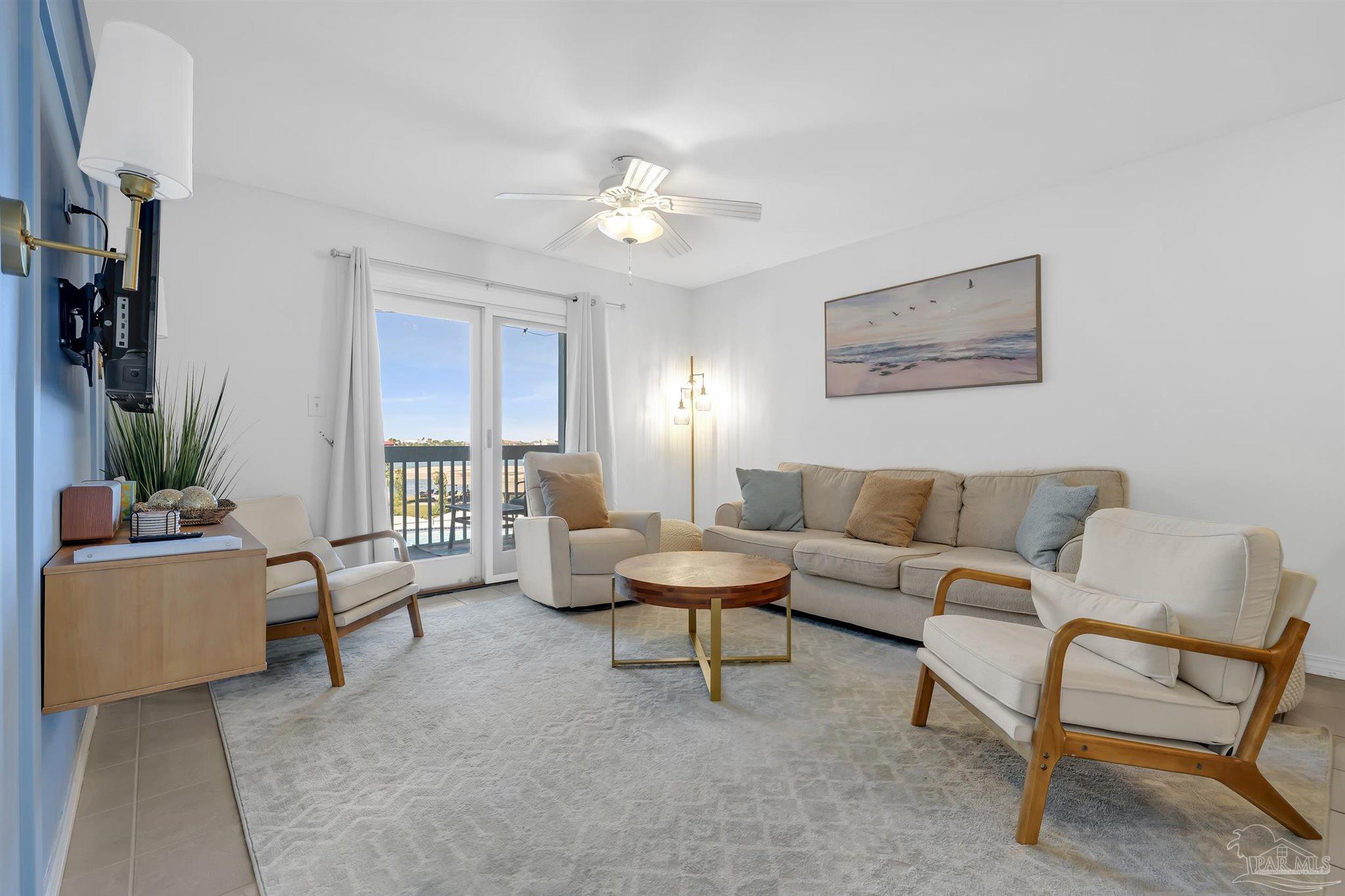 16310 Perdido Key Drive, Unit 9A Perdido Key, FL 32507 - Photo 3 of 26 a living room with furniture and a large window