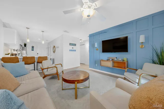 a living room with furniture and a flat screen tv