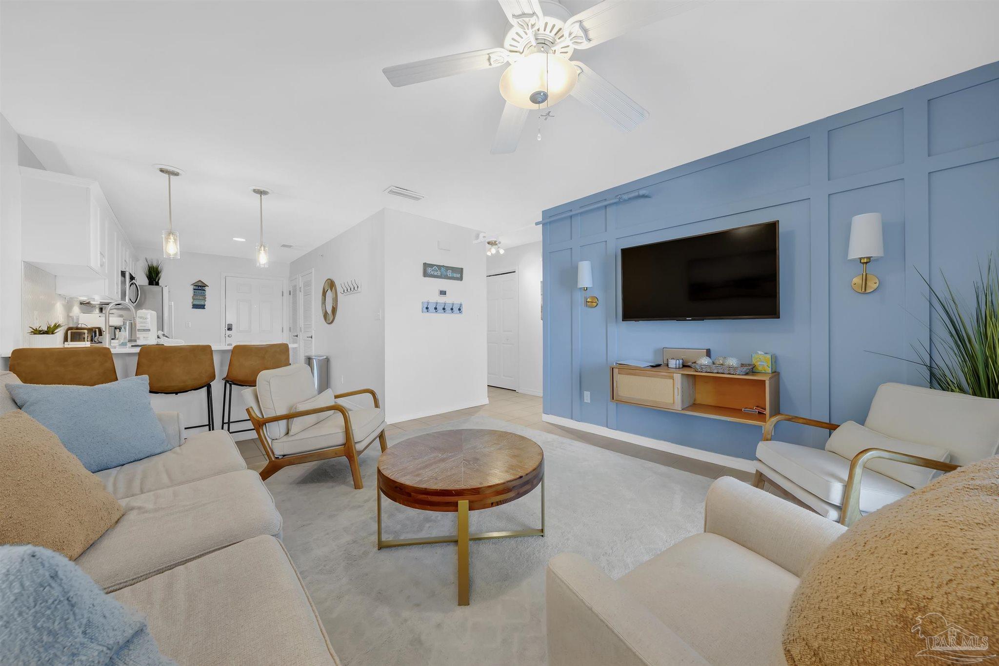 16310 Perdido Key Drive, Unit 9A Perdido Key, FL 32507 - Photo 4 of 26 a living room with furniture and a flat screen tv