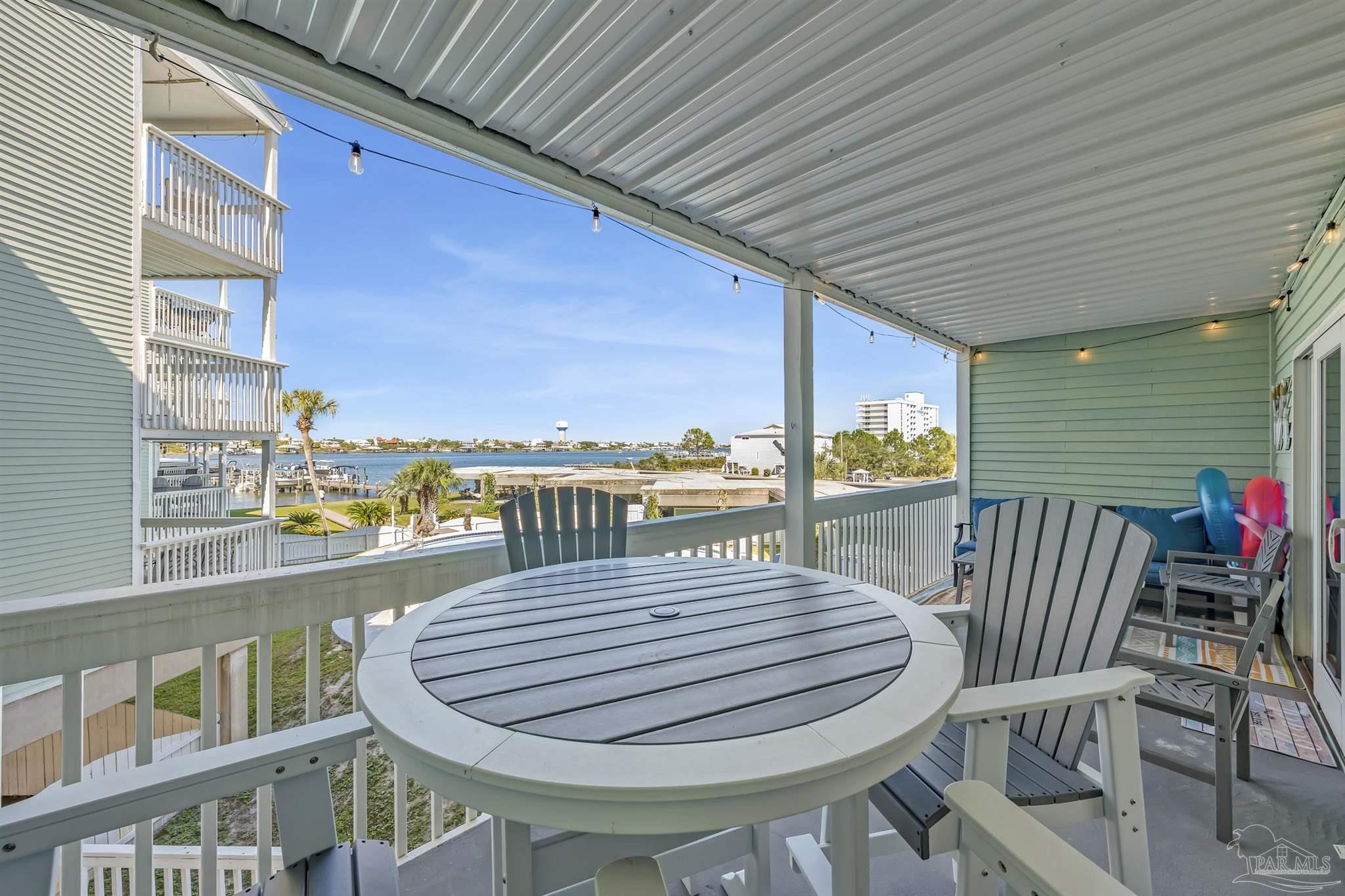 16310 Perdido Key Drive, Unit 9A Perdido Key, FL 32507 - Photo 9 of 26 a view of a balcony dining area with furniture