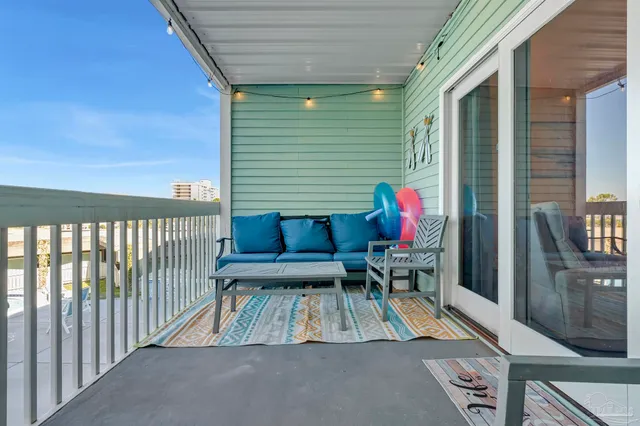 a view of balcony with furniture