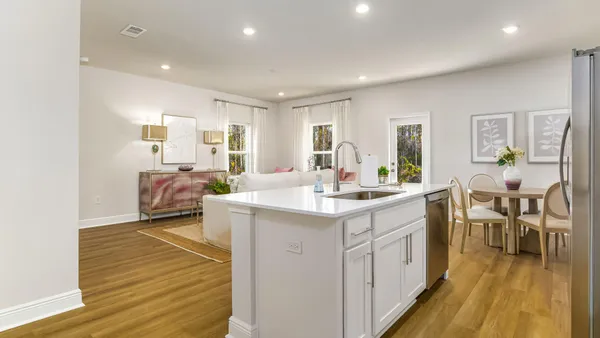 a kitchen with sink and cabinets