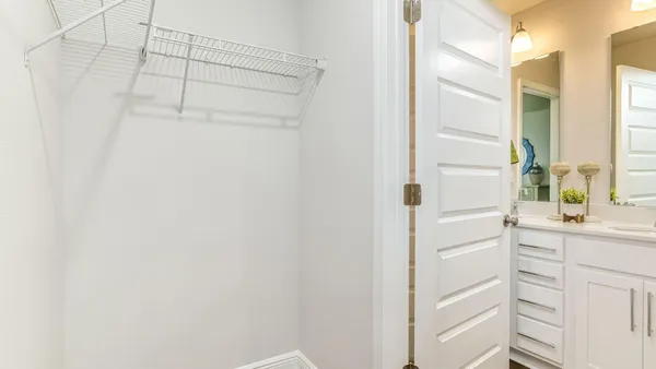 a bathroom with a shower and a sink
