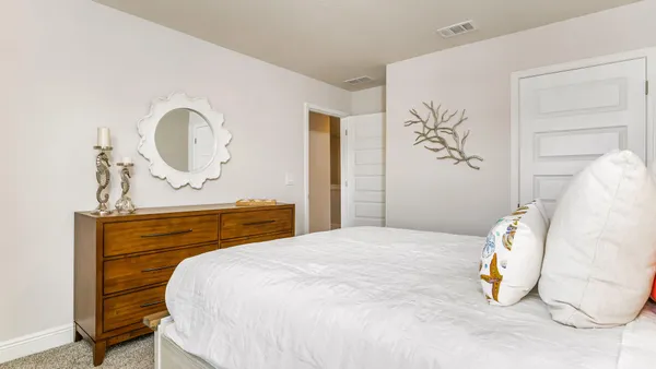 a bedroom with a bed and a table
