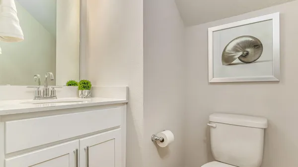 a bathroom with a toilet and a sink