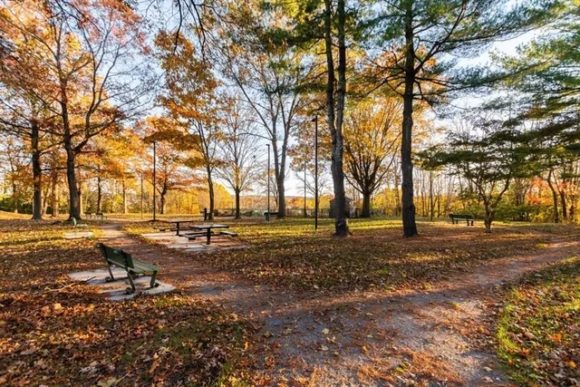a view of a house with yard and deck
