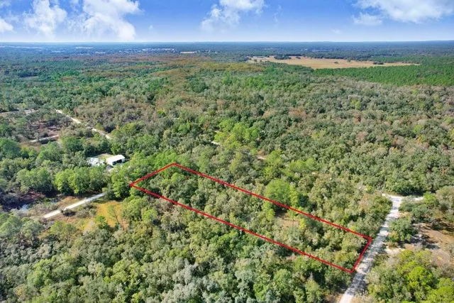 a view of a yard with an outdoor space