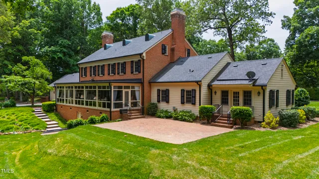 a view of a house with a yard and plants