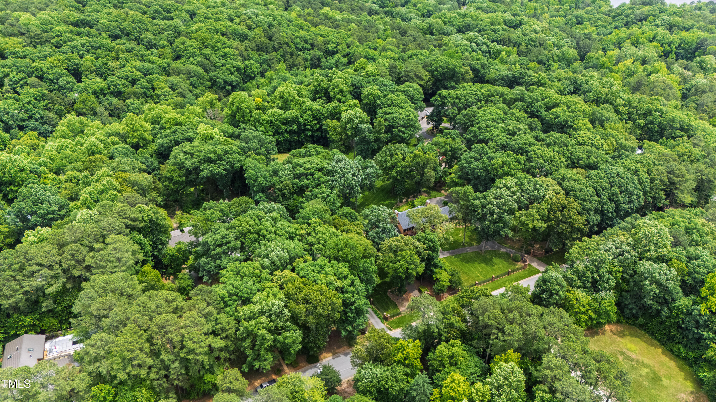 820.2 Kenmore Road Chapel Hill, NC 27514 - Photo 2 of 20 an aerial view of residential house with outdoor space and trees all around