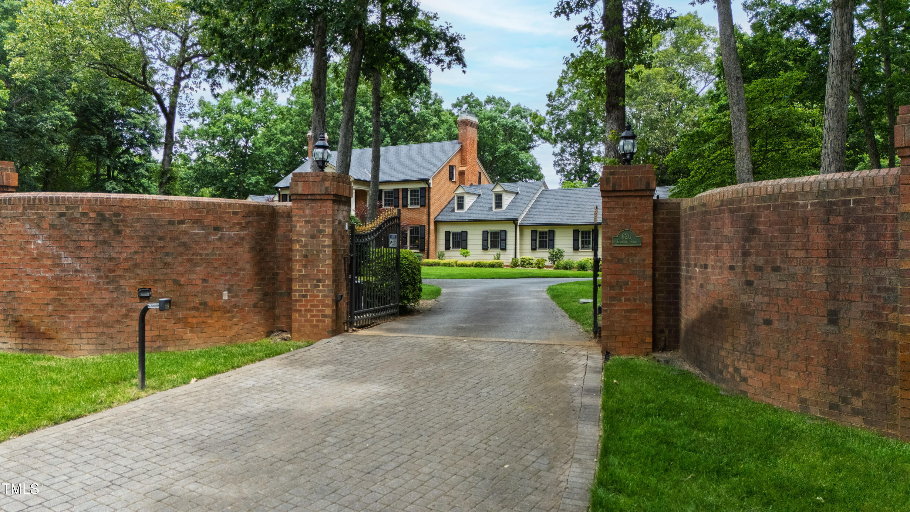 820.2 Kenmore Road Chapel Hill, NC 27514 - Photo 8 of 20 a front view of a house with a yard and trees
