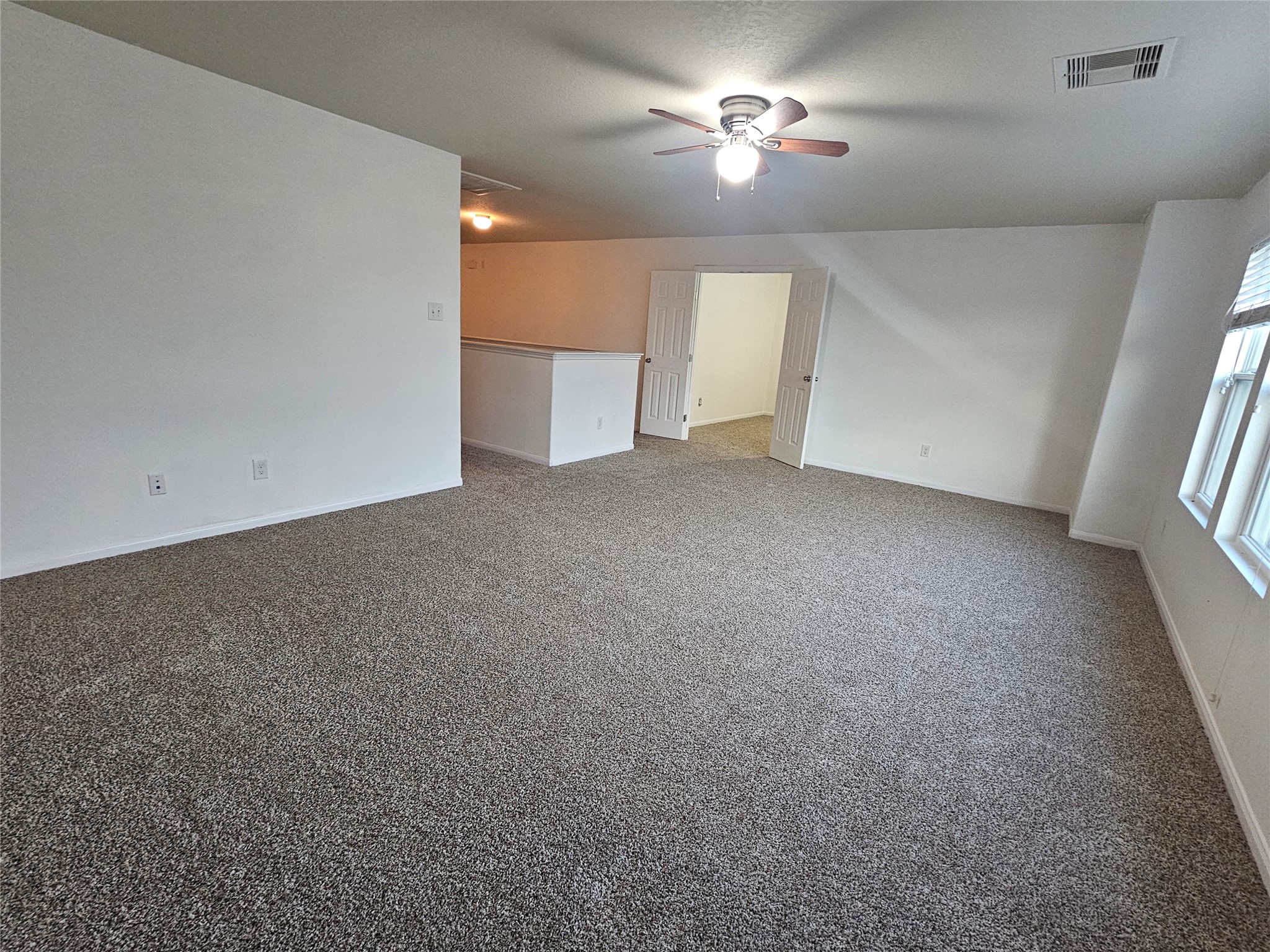 9938 Swallow Drive Conroe, TX 77385 - Photo 6 of 12 a view of empty room with a fireplace