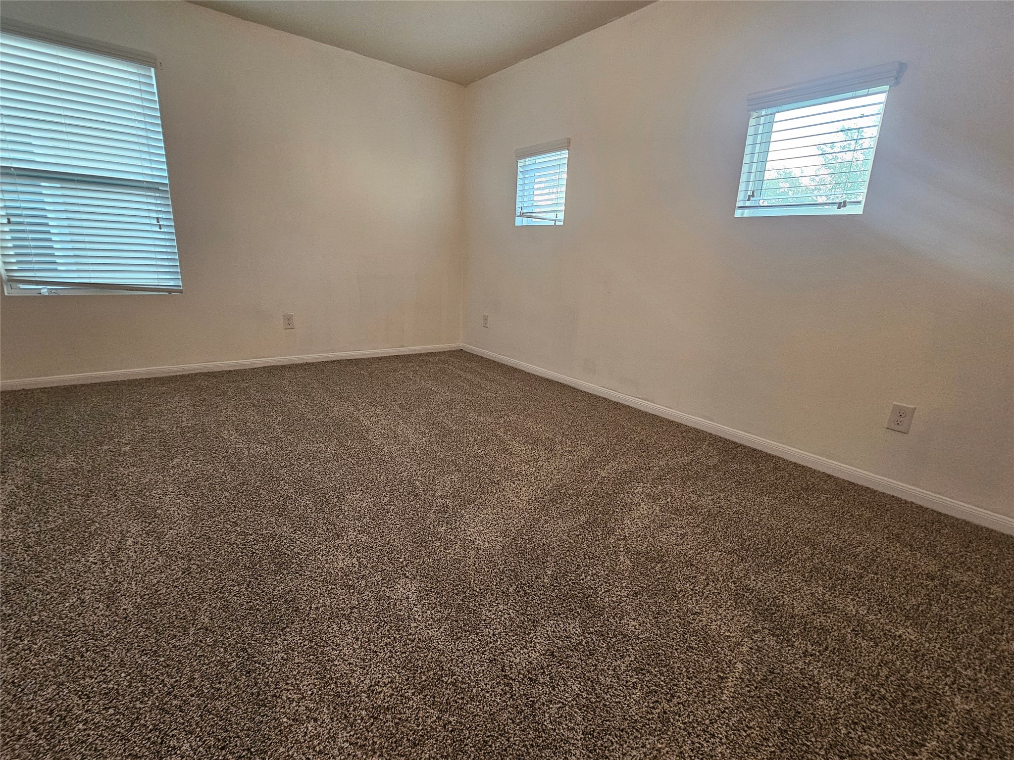 9938 Swallow Drive Conroe, TX 77385 - Photo 10 of 12 an empty room with a window